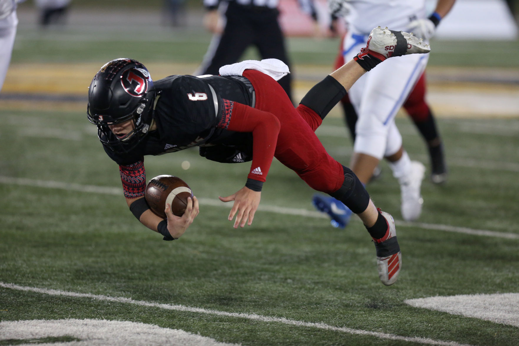 Jackson’s Cael Welker dives forward after being tripped Saturday
